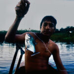 Daniel with a piranha in the Amazon