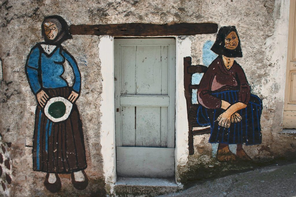 Mural of old ladies in Orsogolo Sardinia