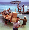 Men unloading a boat on Fua Mulaku, The Maldives (Peter Moore)